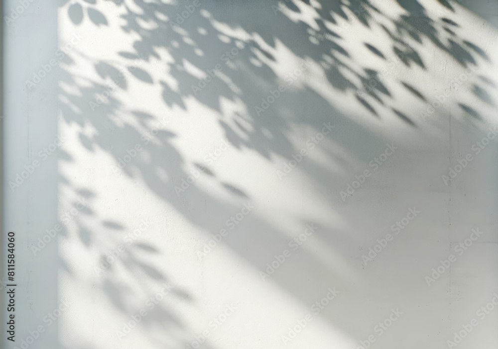 Obraz premium Shadows of leaves on a blank white wall, creating a natural pattern and texture, suitable for a modern background or mockup. Generative AI