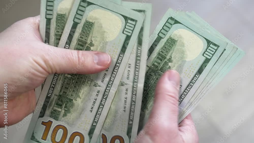 Witness a persons hand elegantly displaying a stack of money, reflecting concepts of finance, earnings, and the allure of winning the lottery. Witness a persons hand elegantly displaying a stack of money, reflecting concepts of finance, earnings, and the allure of winning the lottery.