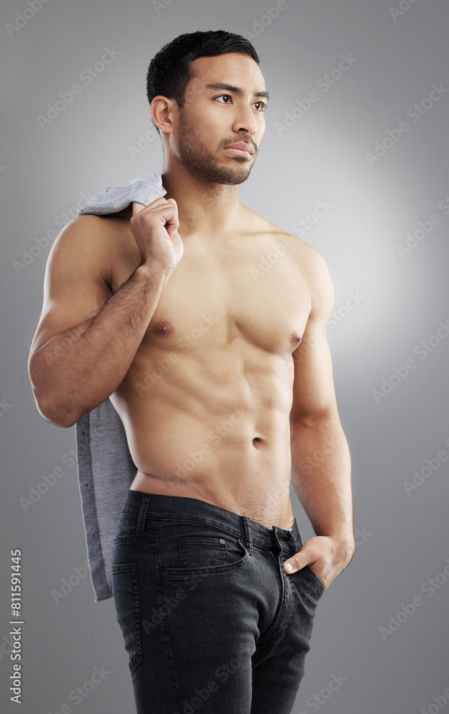 Asian man, muscle and exercise fitness or strong stomach in studio on grey background, confidence or training. Male person, abs and shirtless or weight loss or goals for wellness, workout or pride Asian man, muscle and exercise fitness or strong stomach in studio on grey background, confidence or training. Male person, abs and shirtless or weight loss or goals for wellness, workout or pride