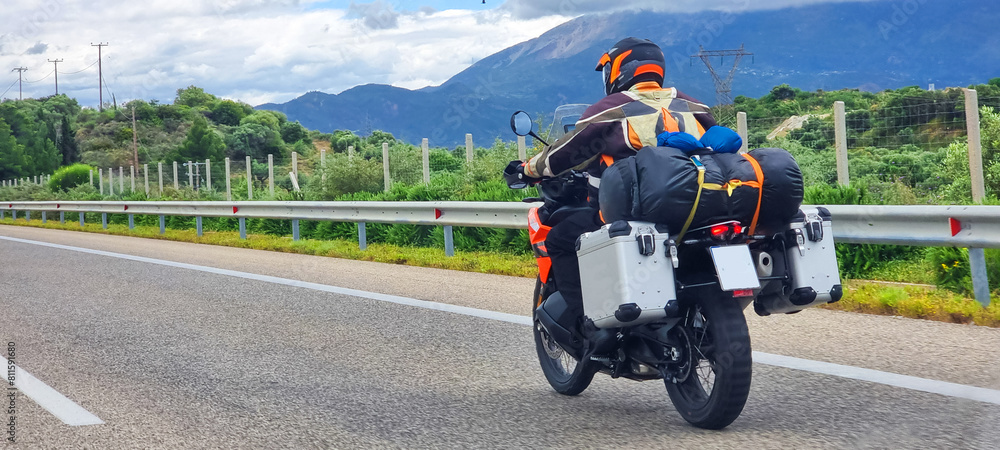 motorbike travelling speeding on asphalt road in cloudy day in greece spring season motorbike travelling speeding on asphalt road in cloudy day in greece spring season