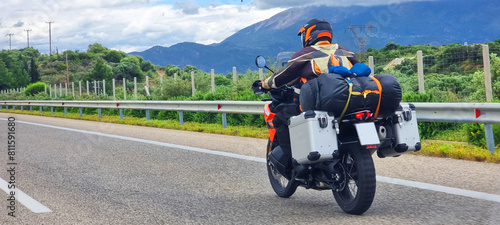  motorbike travelling speeding on asphalt road in cloudy day in greece spring season photo