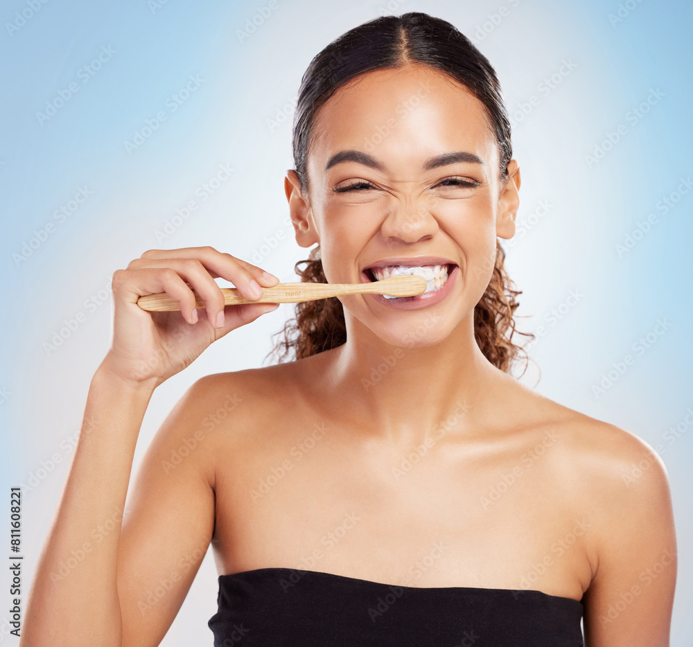 Woman, portrait and toothpaste or brushing teeth in studio for healthy hygiene, dentist or blue background. Female person, face and smile self care with morning routine or oral, treatment or cleaning Woman, portrait and toothpaste or brushing teeth in studio for healthy hygiene, dentist or blue background. Female person, face and smile self care with morning routine or oral, treatment or cleaning