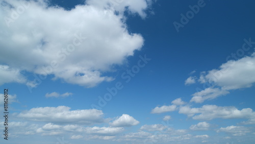 Blue sky cumulus and stratocumulus clouds. Scenic aerial background of blue sky with cumulus clouds. Clean azone layer. Timelapse. photo