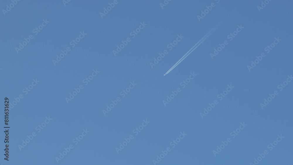 Aeroplane In Sky With Contrail Vapor Trails Clear Blue Sky Australia, Victoria, Gippsland, Maffra Daytime Wide Shot Aeroplane In Sky With Contrail Vapor Trails Clear Blue Sky Australia, Victoria, Gippsland, Maffra Daytime Wide Shot