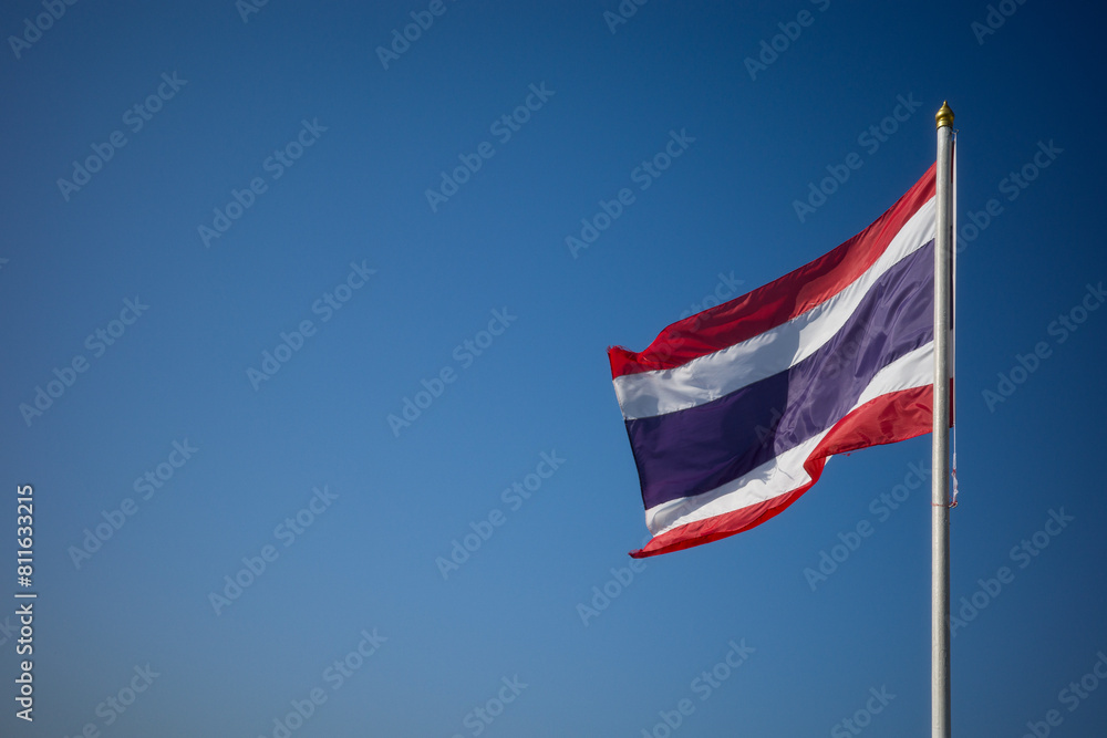 Flag of Thailand national against blue sky waving with pride colorful background Flag of Thailand national against blue sky waving with pride colorful background