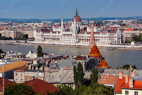The Hungarian Parliament Building in Budapest, Hungary. It is the seat of the National Assembly of Hungary. It lies in Lajos Kossuth Square, on the bank of the River Danube.  photo