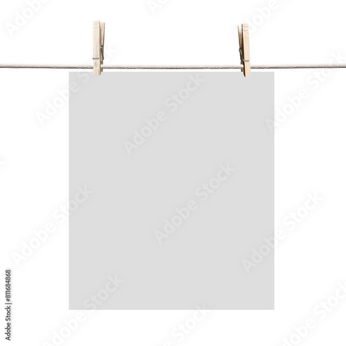 A blank paper sheet clipped to a rope by wooden clothespins, on a white background, concept of hanging notice