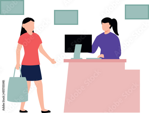 A girl is standing at the cash counter.