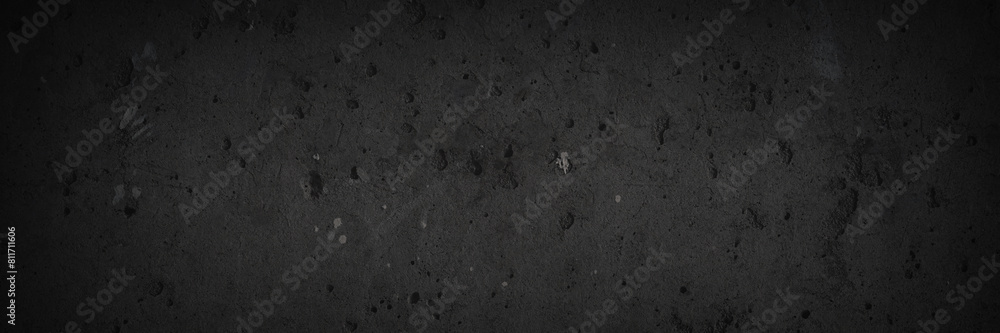 Texture of old concrete wall. Rough dark gray concrete surface with spots, cracks, noise and grain. Dark wide panoramic background for grunge style design. Shaded vintage texture with vignette. Texture of old concrete wall. Rough dark gray concrete surface with spots, cracks, noise and grain. Dark wide panoramic background for grunge style design. Shaded vintage texture with vignette.