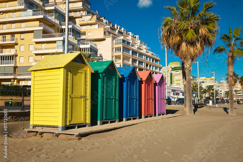 Brightly painted summer beach change rooms