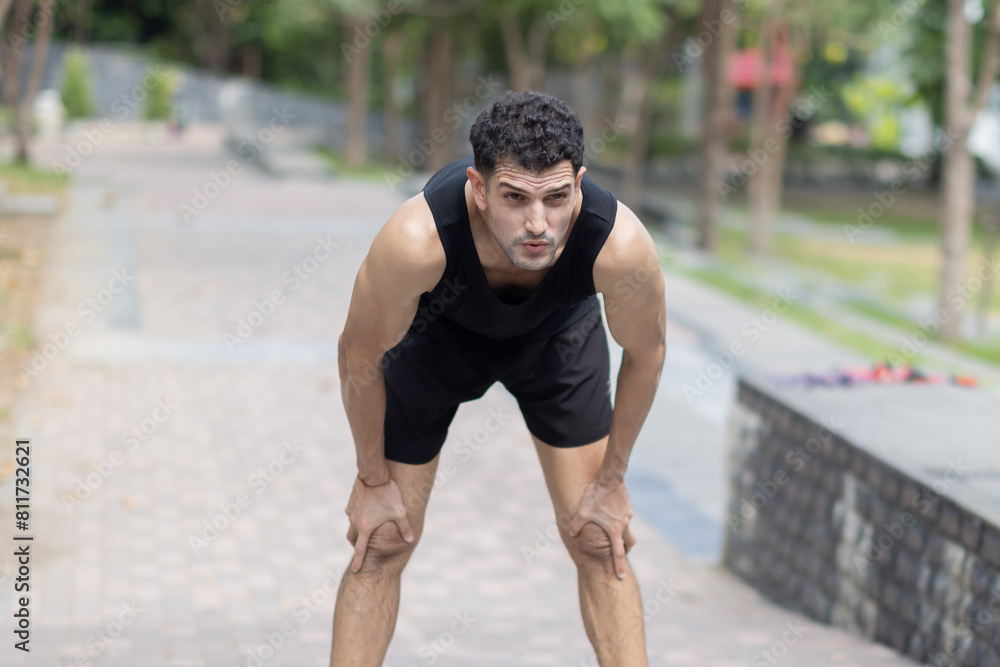 Obraz premium Tired runner taking a rest after running