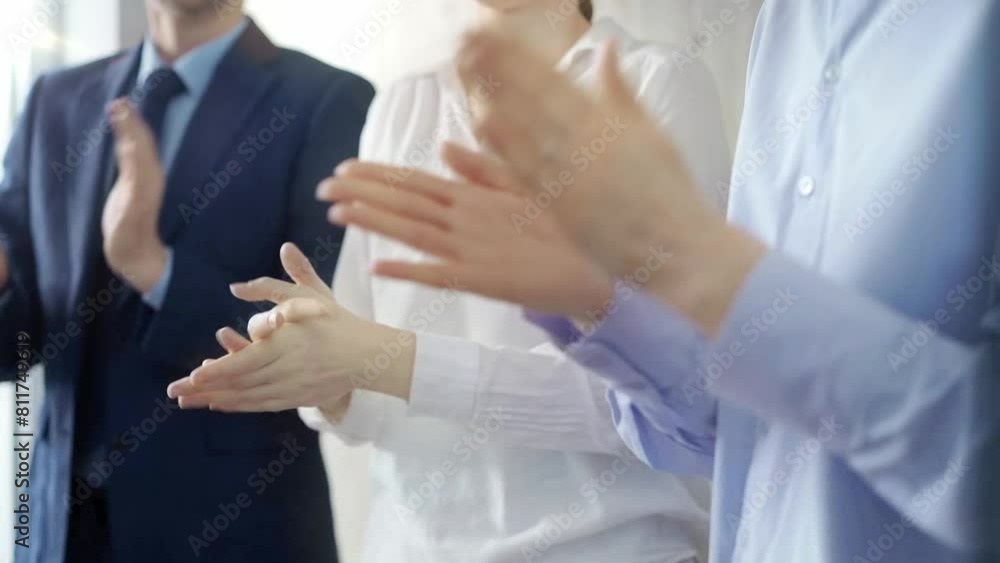 Diverse business team clapping hands in a modern office. Business people applauding with close up of hands Diverse business team clapping hands in a modern office. Business people applauding with close up of hands