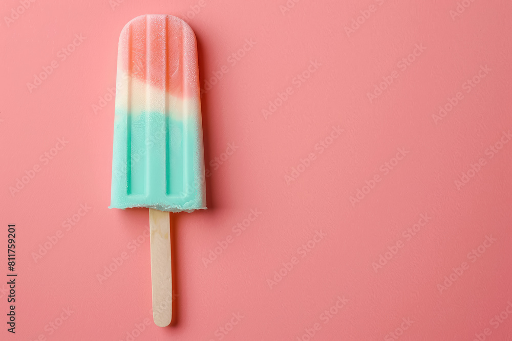refreshing summer popsicle in peach and turquoise tones on a pink background with copy space for tewt refreshing summer popsicle in peach and turquoise tones on a pink background with copy space for tewt