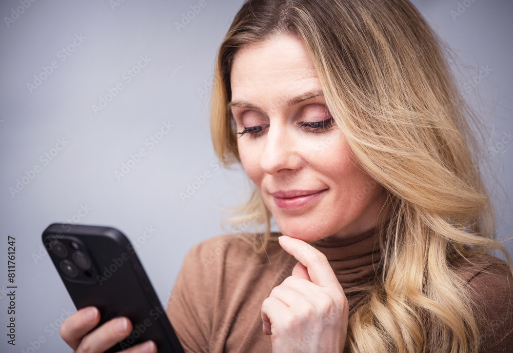 young woman reading on social networks, typing text or shopping online. Mobile phone in the hands of a girl. young woman reading on social networks, typing text or shopping online. Mobile phone in the hands of a girl.