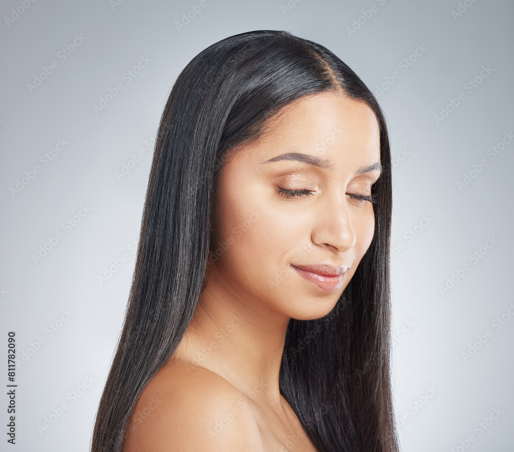 Fototapeta premium Hair care, woman and shine with beauty, wellness and grooming routine on white studio background. Happy person, model and girl with glow, dermatology and growth with shampoo, keratin and treatment