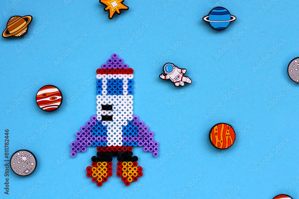 children craft cosmonaut a rocket in space from mosaic. preschool creativity, fantasy development.