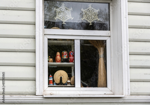 landscape with a house window and toys on the windowsill