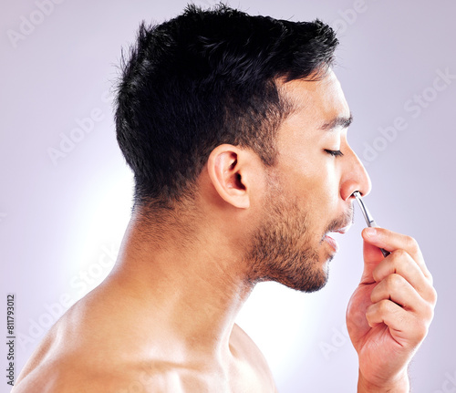 Fotografie Man, tweezer and nose for plucking of hair, studio and routine in morning, aesthetic and hand