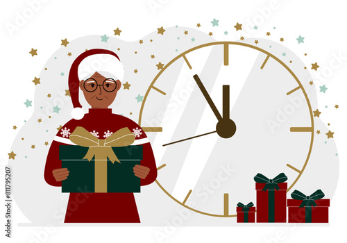 A woman in a red sweater and a red cap with a large gift box. 5 minutes before Christmas or New Year.