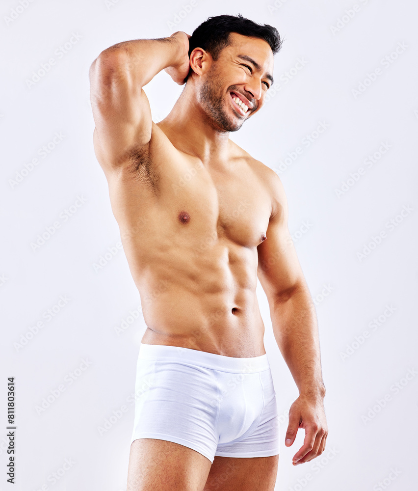 Fitness, man and happy in underwear on studio, white background or bodybuilder in space. Healthy, athlete and model flexing abs, arms or muscle from exercise and progress from workout at gym Fitness, man and happy in underwear on studio, white background or bodybuilder in space. Healthy, athlete and model flexing abs, arms or muscle from exercise and progress from workout at gym