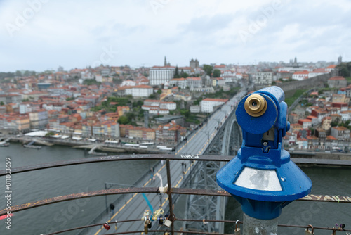 viewpoint with binoculars of the city of Porto overlooking the city and Dom Luis bridge in Portugal