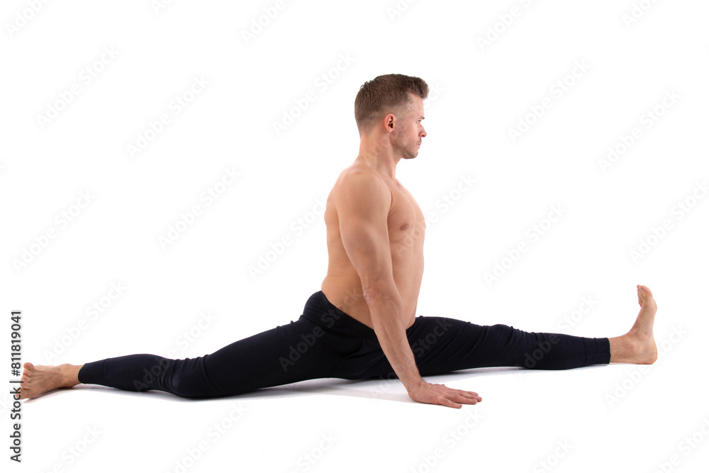 Sports and healthy lifestyle. An attractive man is doing yoga and pilates. White background.