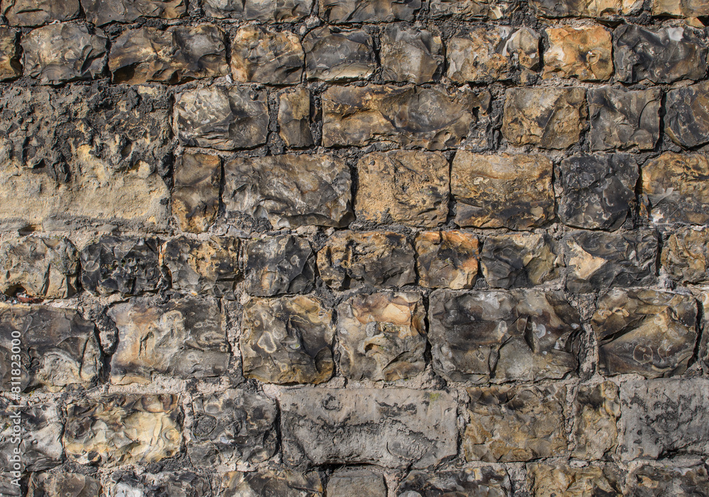 Texture of masonry of hewn stones of a medieval wall Texture of masonry of hewn stones of a medieval wall