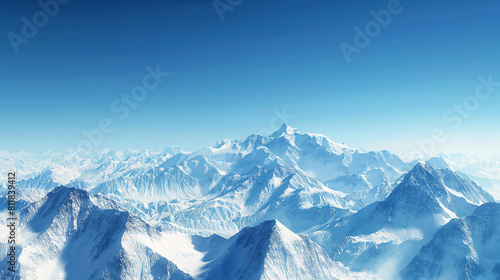 Snow-covered mountain range under a clear blue sky, serene winter landscape 