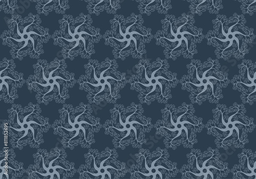 pattern in blue of spinning ornaments with swirling, spirals