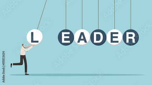 Showing initiative in achieving business goals, motivation and determination to succeed, leadership qualities for great success and career growth, a man launches balls with the inscription leader.