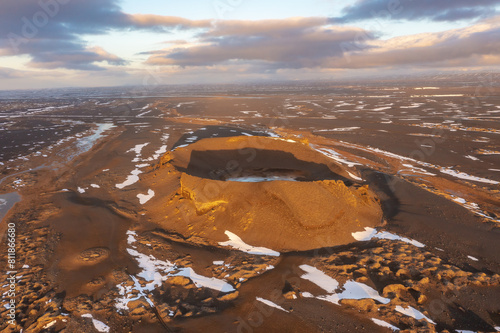 Cosmic mystical drone inspects snow-capped mountains and pseudo-craters. Myvatn in north of Iceland. photo