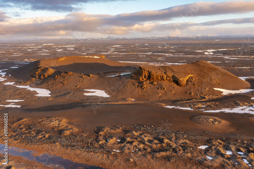 Cosmic mystical drone inspects snow-capped mountains and pseudo-craters. Myvatn in north of Iceland. photo
