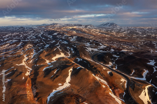 Cosmic mystical drone inspects snow-capped mountains and pseudo-craters. Myvatn in north of Iceland. photo