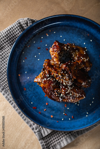 Crispy chicken wings in teriyaki sauce