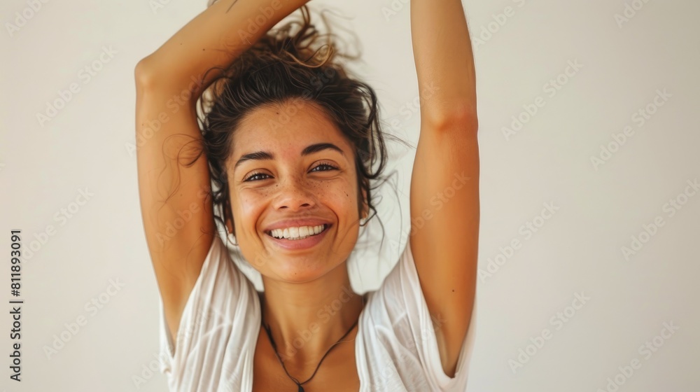 A woman flashes a radiant smile while striking a yoga pose against a crisp white backdrop celebrating Yoga Day A woman flashes a radiant smile while striking a yoga pose against a crisp white backdrop celebrating Yoga Day