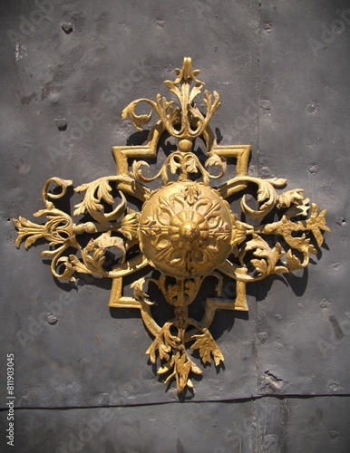 Canvas Print Ornamental vintage door handle and decorations, part of a door of a historical c
