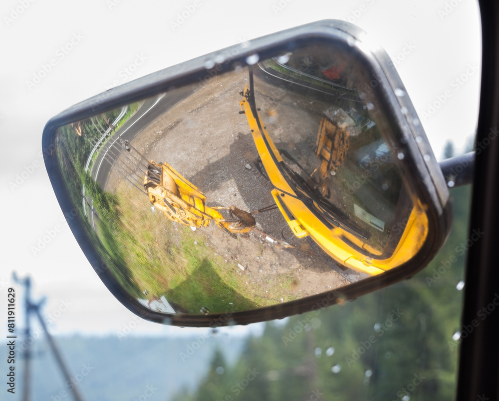 A side-view mirror of the mobile crane.