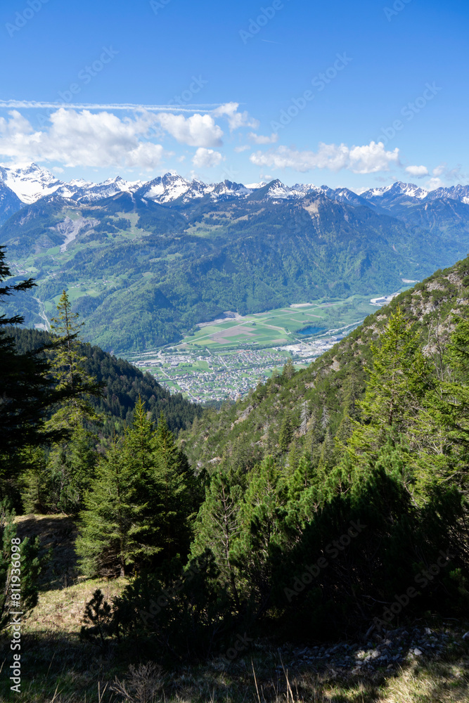 view from high up into a valley and the opposite landscape with mountains view from high up into a valley and the opposite landscape with mountains