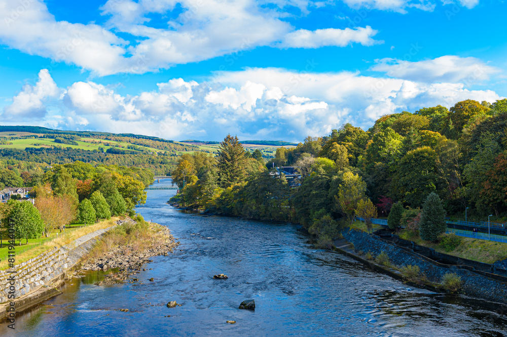 The River Tummel, part of a hydroelectric generation system, viewed from the walkway near Loch Faskally, Pitlochry, Perth and Kinross, Scotland, UK. Landscape horizontal format with copy space.