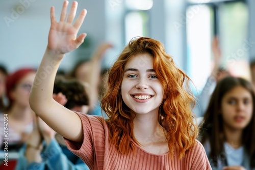 smiling happy teenager girl student raising hand at school classroom, education and learning concept
