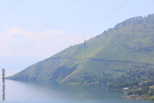 Stunning scenery of volcanic lake Toba - largest and deepest crater lake in the world located in North Sumatra, Indonesia