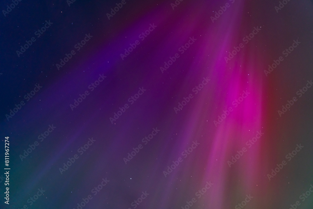 Naklejka premium The Northern Lights in a graveyard on Anglesey Wales