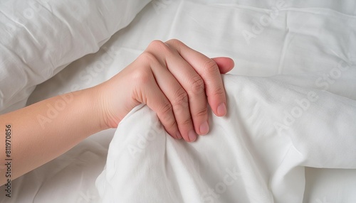 Generated image of woman's hand holding cotton white bed sheet ai generated