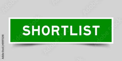 Square sticker label with word shortlist in green color on gray background