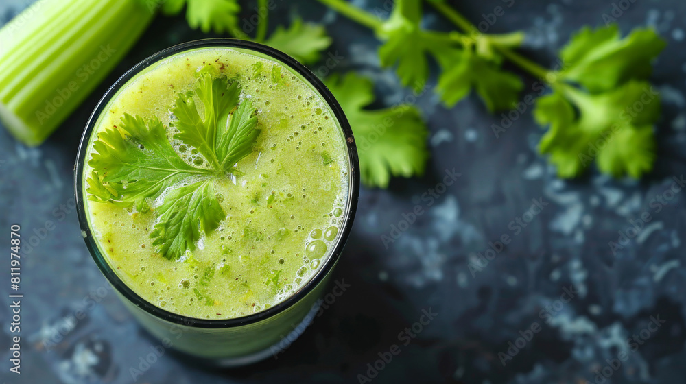 Vibrant green celery smoothie garnished with a leaf, served in a glass on a dark, textured backdrop, symbolizing healthy lifestyle choices Vibrant green celery smoothie garnished with a leaf, served in a glass on a dark, textured backdrop, symbolizing healthy lifestyle choices