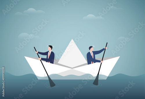 Choosing the direction of the business. Different opinions. Businessmen in the boat are rowing at the opposite direction from each other.