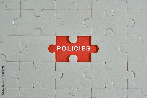 Piece of jigsaw puzzle with words Policies.