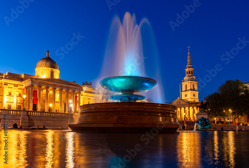 Fountain on Trafalgar square and National Gallery at sunset, London, UK photo