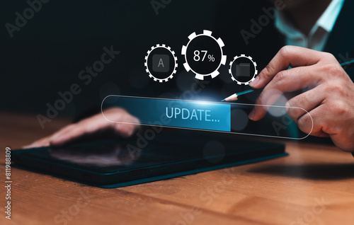 Installing update system software for device operating systems to be up to date with the new version. Graphics icon showing updating function screen loading on computer tablet.