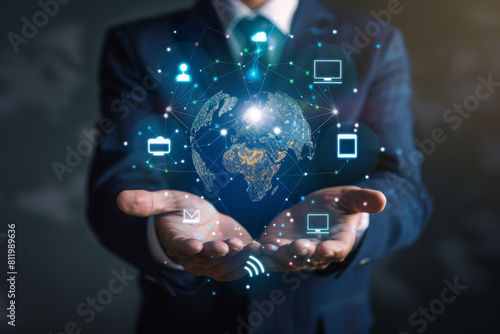 A man in a suit is holding a globe in his hands